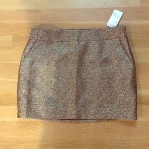 Gold mini skirt with tags